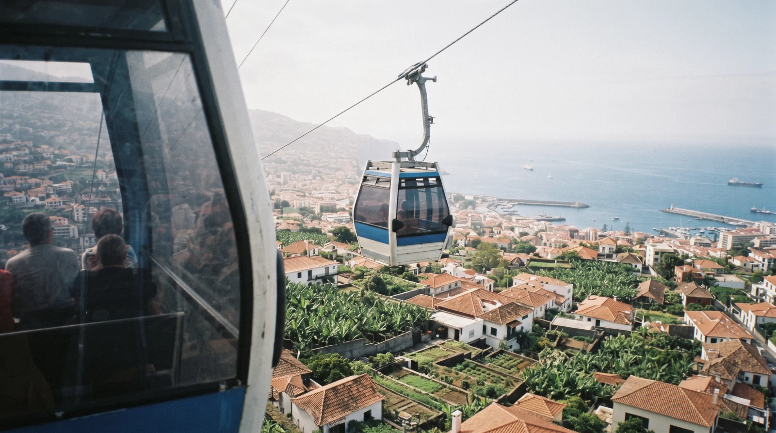View over the red roofs and harbour of Funchal, Madeira, seen from the hills above the city on a two-day itinerary