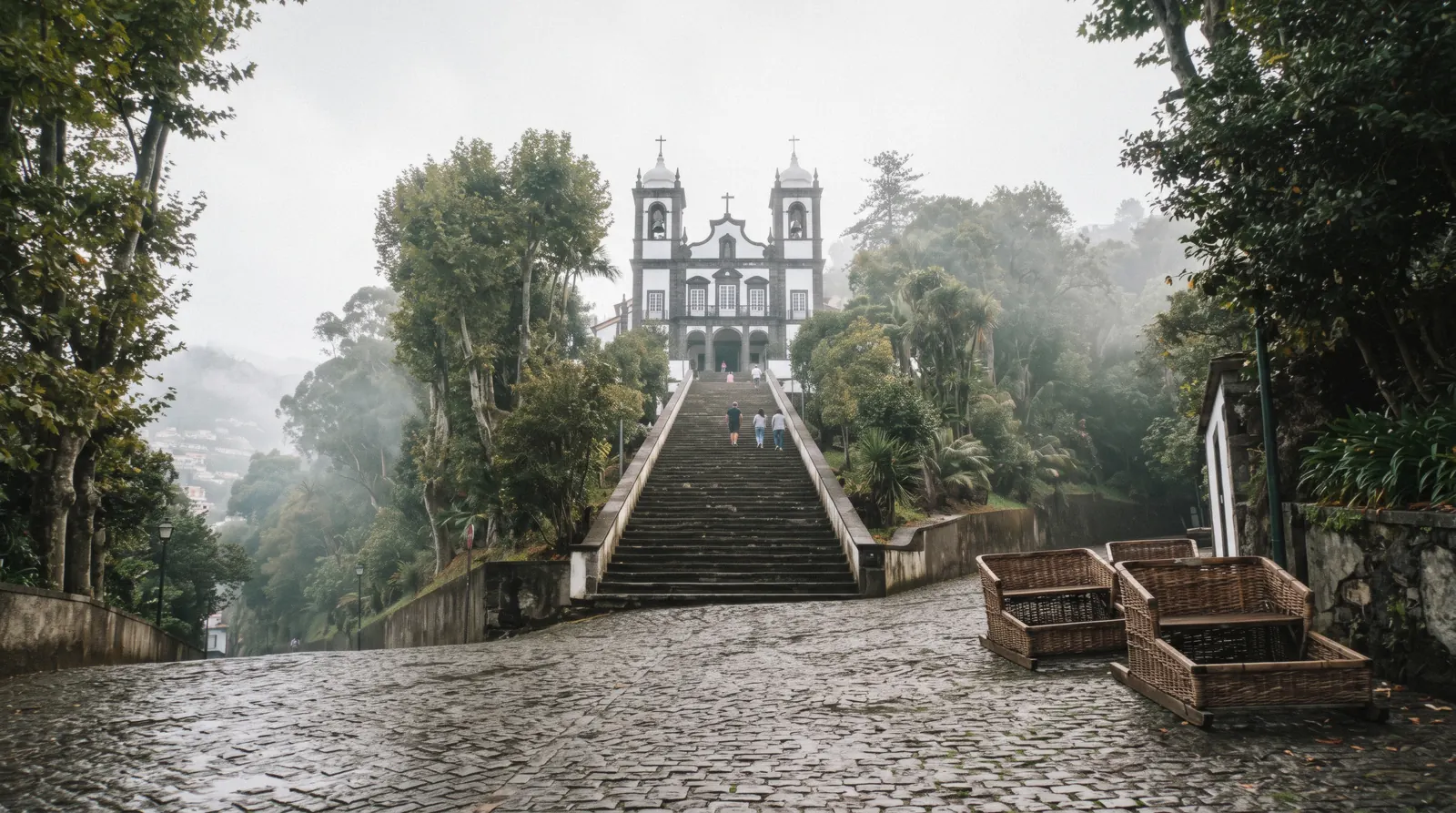 The hilltop parish of Monte above Funchal, Madeira, with the church and green slopes seen from the city below