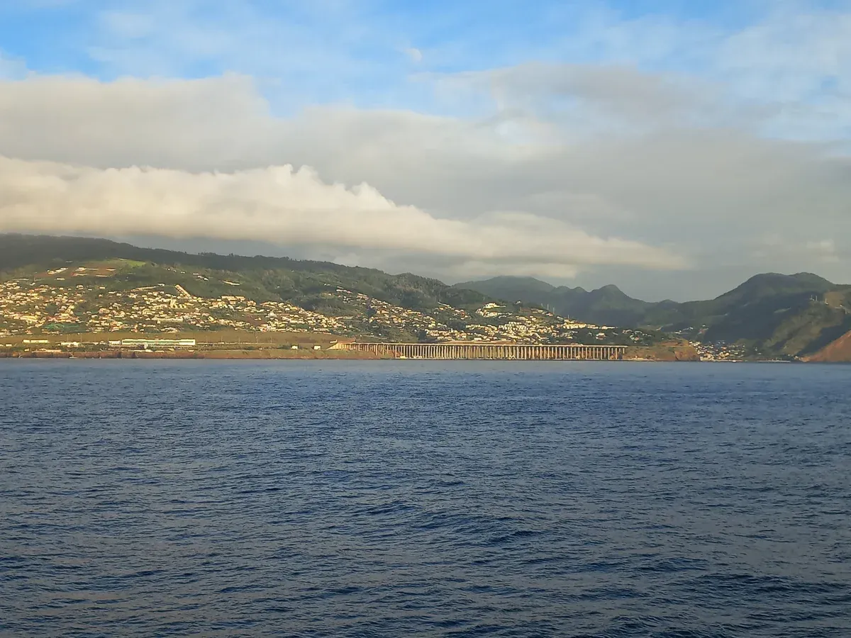 The runway extension of Funchal Airport on its concrete pillars over the Atlantic, seen from the sea near Santa Cruz, Madeira