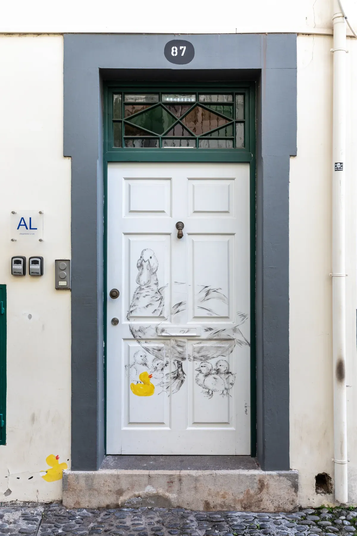 A hand-painted front door in the Zona Velha old town of Funchal, Madeira, part of the open doors street art project on the walk from the cruise port