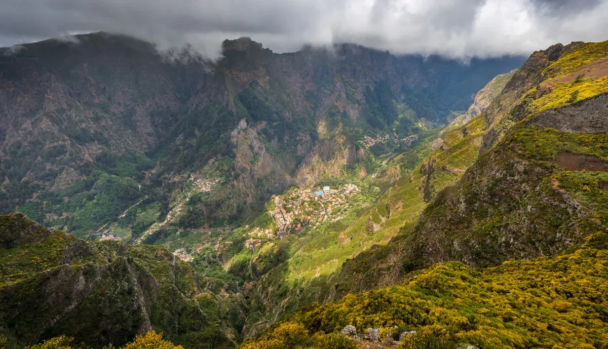 The village of Curral das Freiras seen from above, sitting inside a green volcanic valley near Funchal, Madeira