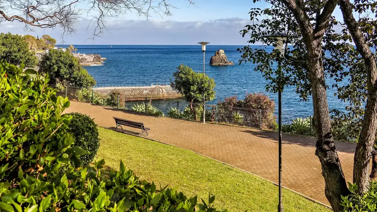 The seaside promenade path in the Lido area of Funchal, Portugal, below the Estrada Monumental hotel strip