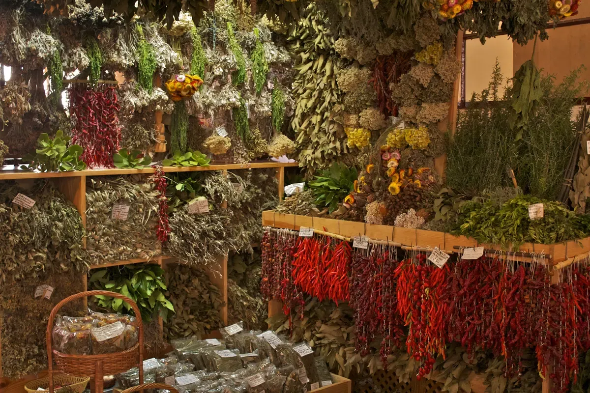 Dried herbs and chillies for sale under cover at the Mercado dos Lavradores in Funchal, Portugal