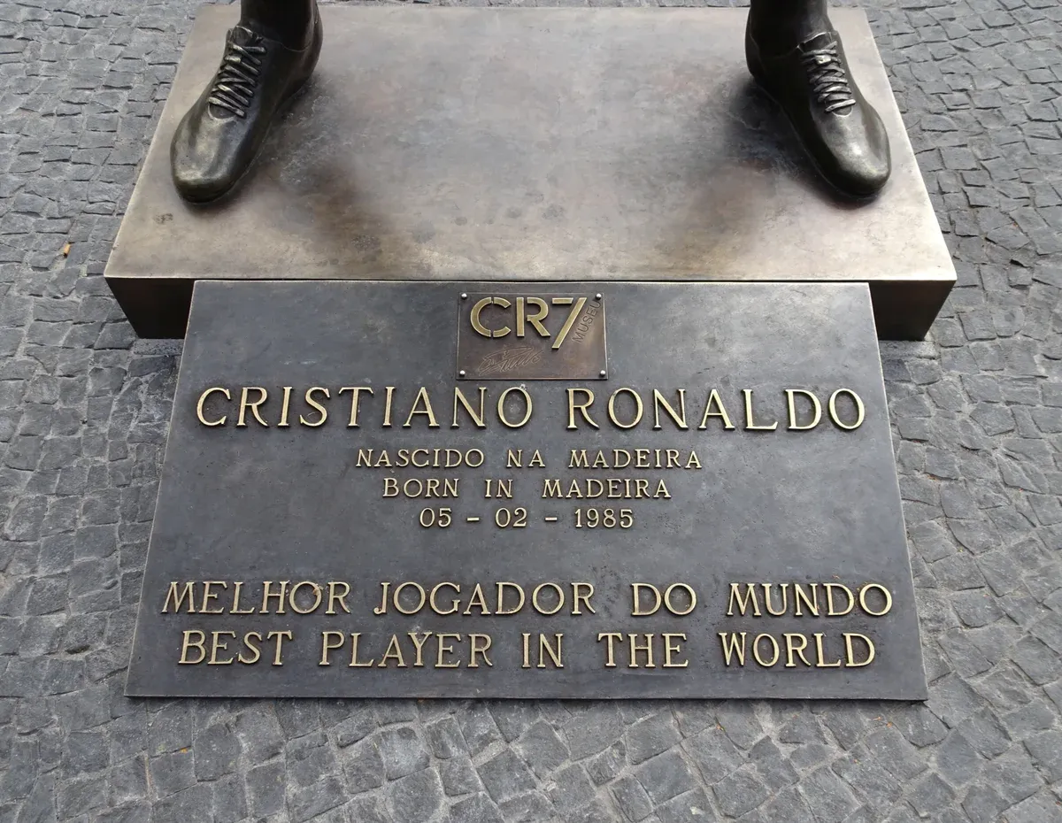 The bronze statue plaque naming Cristiano Ronaldo outside the CR7 Museum in Funchal, Madeira