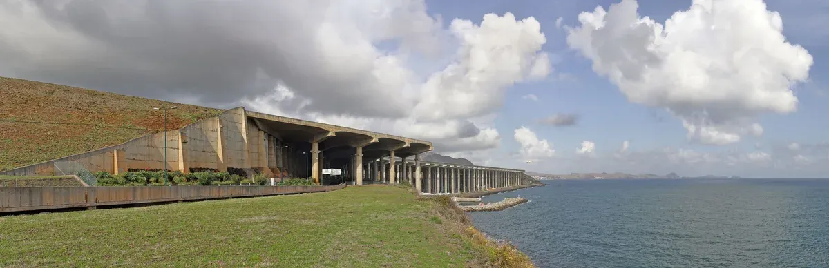 The elevated concrete pillar runway extension of Madeira airport reaching over the sea near Funchal, Portugal