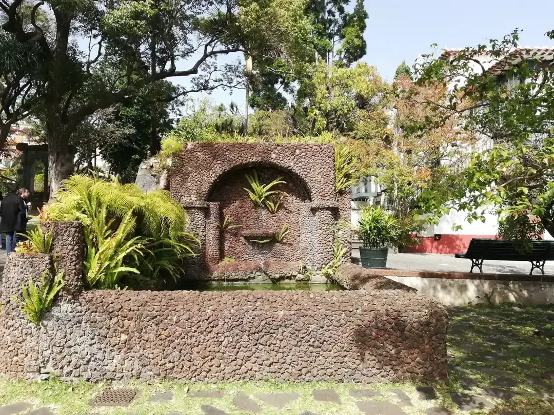 A stone garden feature and fountain in the grounds of the Quinta das Cruzes Museum in Funchal, Madeira, Portugal