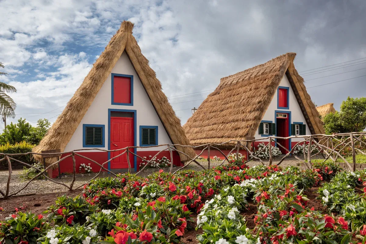 Two thatched traditional houses in the village of Santana on a day trip from Funchal, Madeira