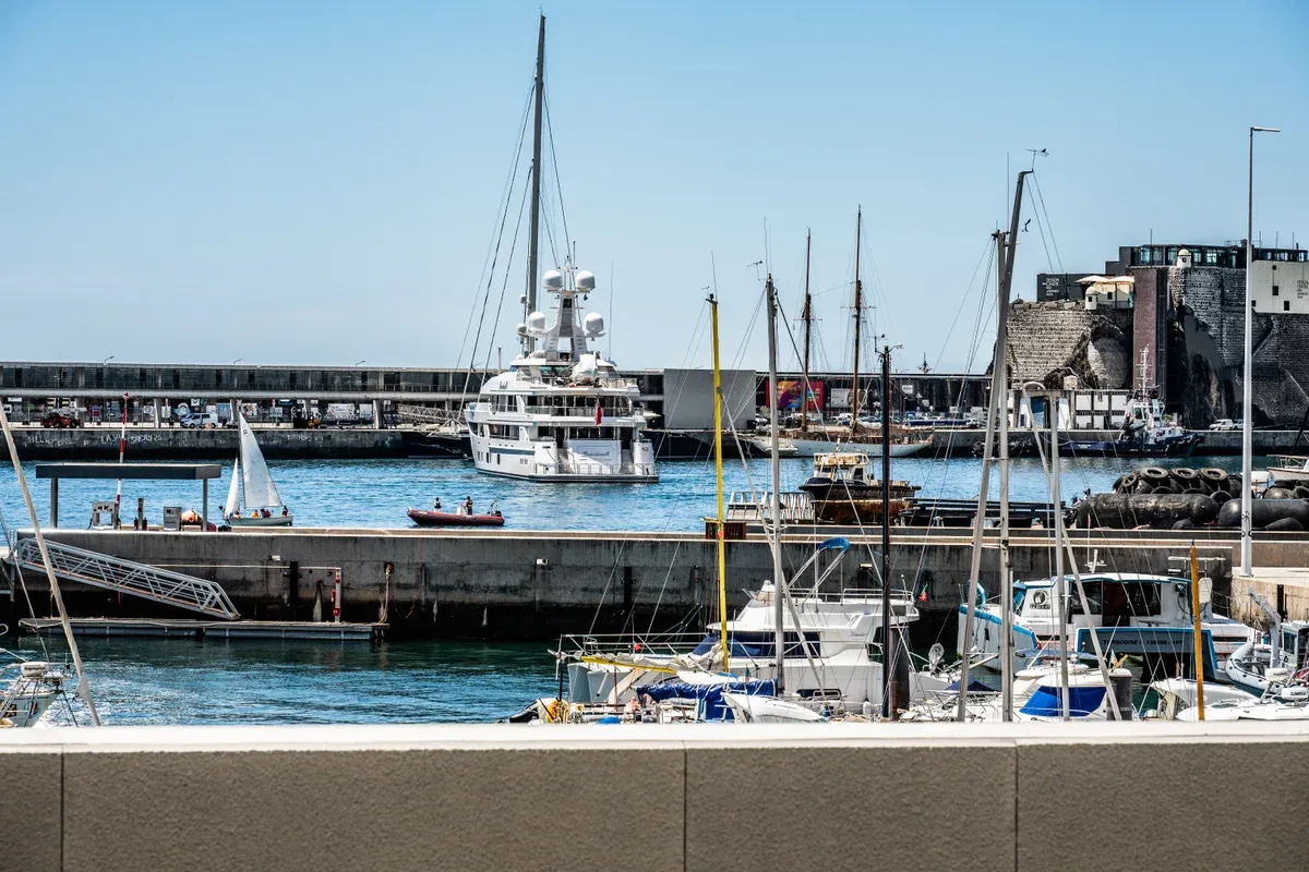 Yachts and the São Tiago fort walls seen across Marina do Funchal, Funchal, Madeira